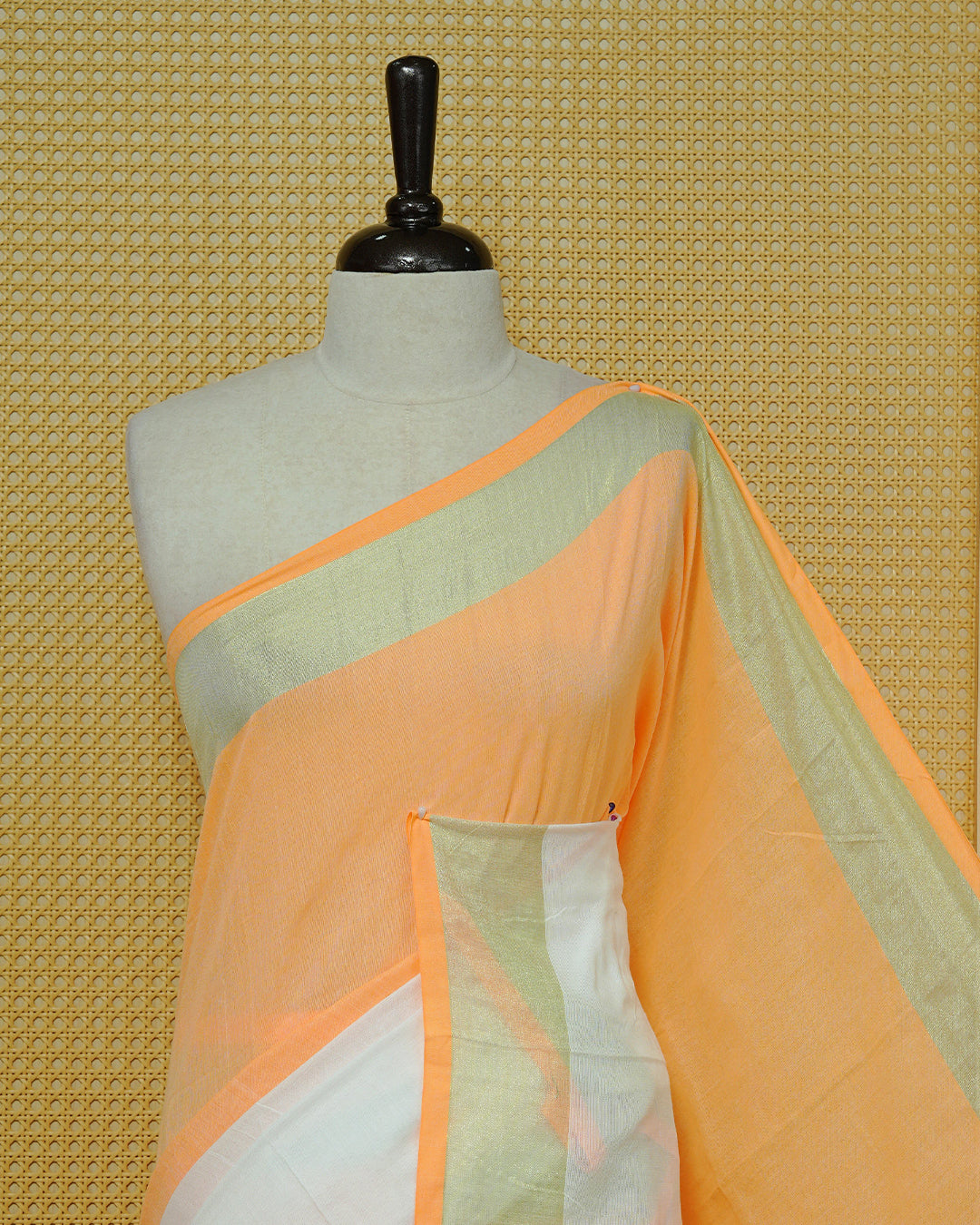 Orange & White Colour Mul Cotton Saree featuring a soft dual-tone body with a subtle golden zari border, elegant striped zari detailing on the pallu, and white tassels.