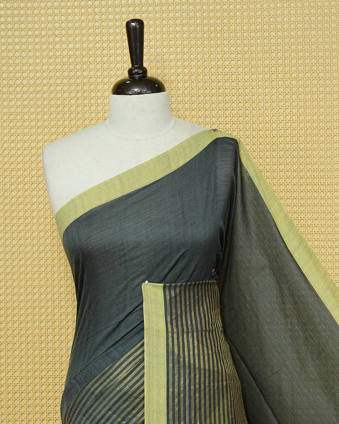 Grey Colour Half & Half Mul cotton saree featuring Gold zari Stripes on one side, Complemented by contrast Green colour Border & tassels.