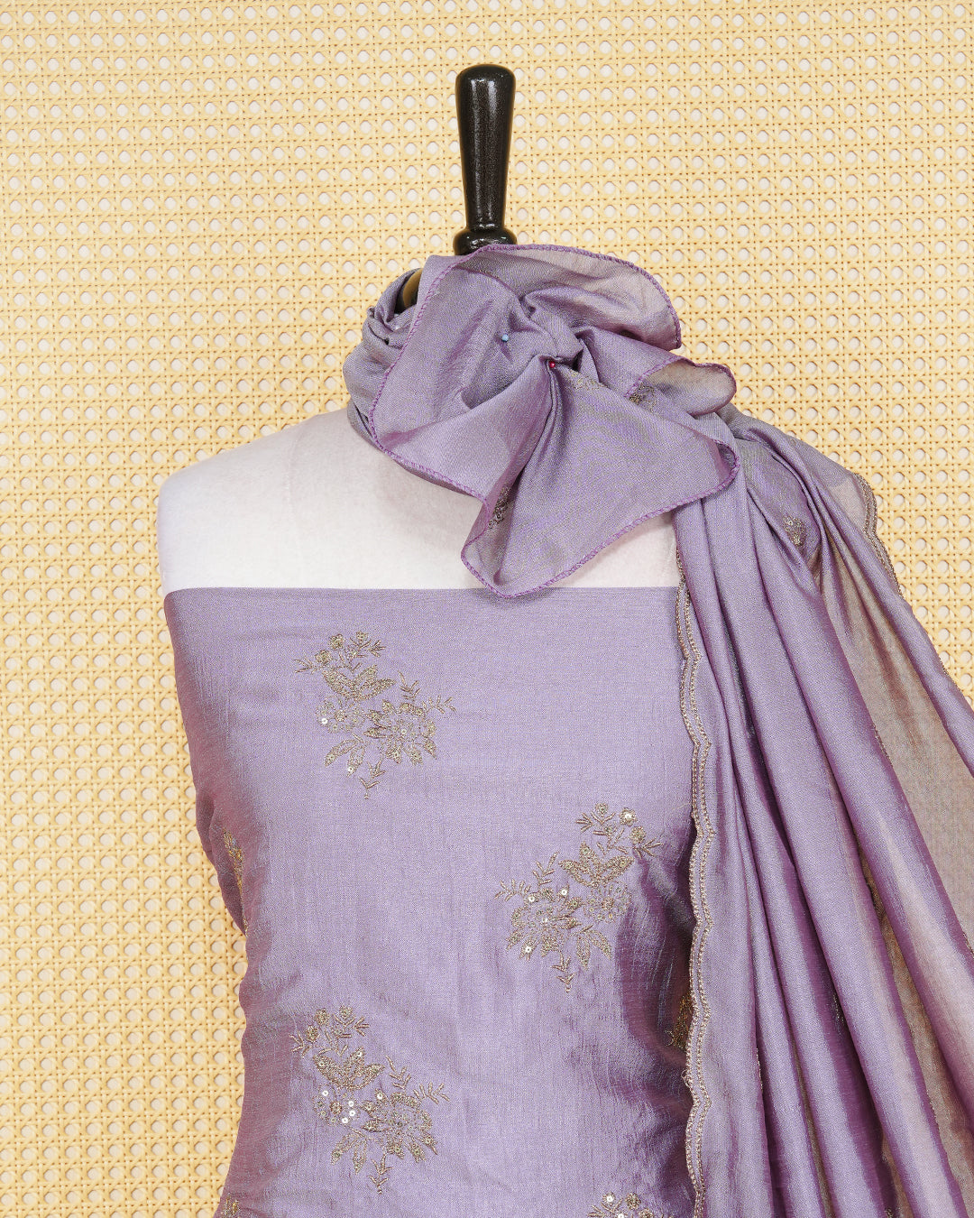 Dust Lavender Georgette Salwar Material Features an Elagent Floral Emproidary Pattern Aborned With Shimmering Metallic Gold Thread and Beadwork, paired with matching bottom & elegant Duptta