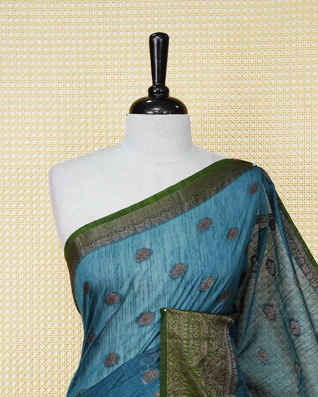Teal blue colour semi linen saree thread motifs on body, contrast green colour gold zari border, rich pallu comes with matching blouse piece