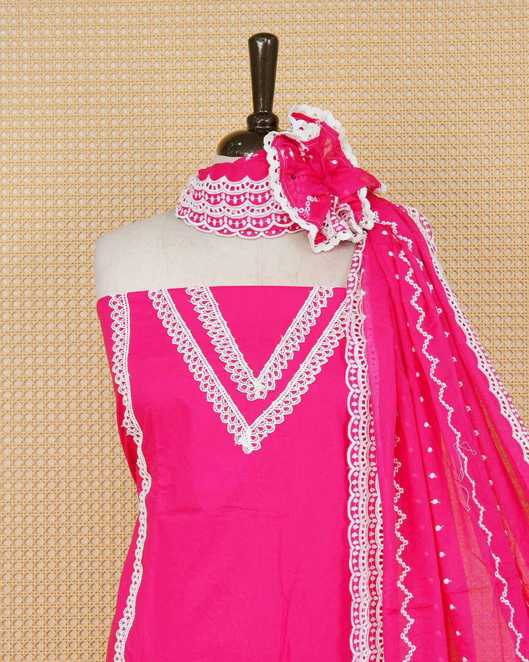 Rani pink colour Cotton Salwar Material Featuring an Threadwork on Body, lace work on neck portion, Paired With a Matching Bottom and an Elegant Dupatta.