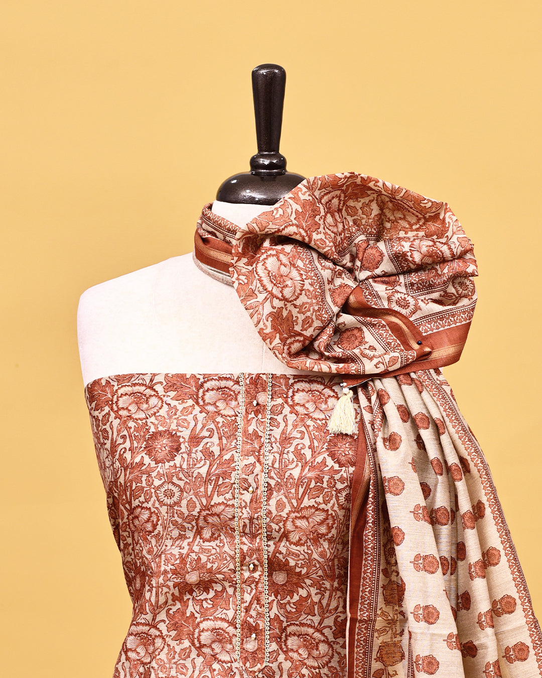 Brown colour Salwar material with Floral kodi pattern on body, matching bottom & Dupatta.