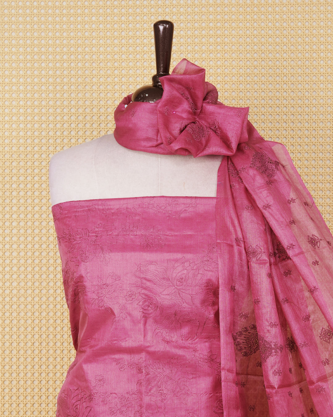 Dusty pink colour Tussar Salwar material featuring Threadwork on the body, paired with a matching bottom and an elegant dupatta.