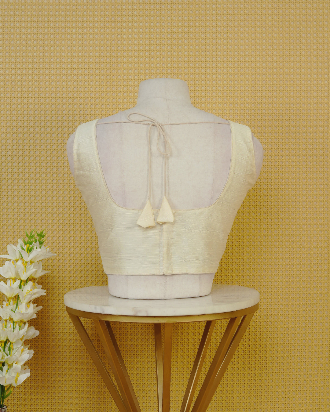 Cream Colour Plain Blouse Featuring A Classic U Neckline, Sleeveless Design, And A Simple, Clean Finish.