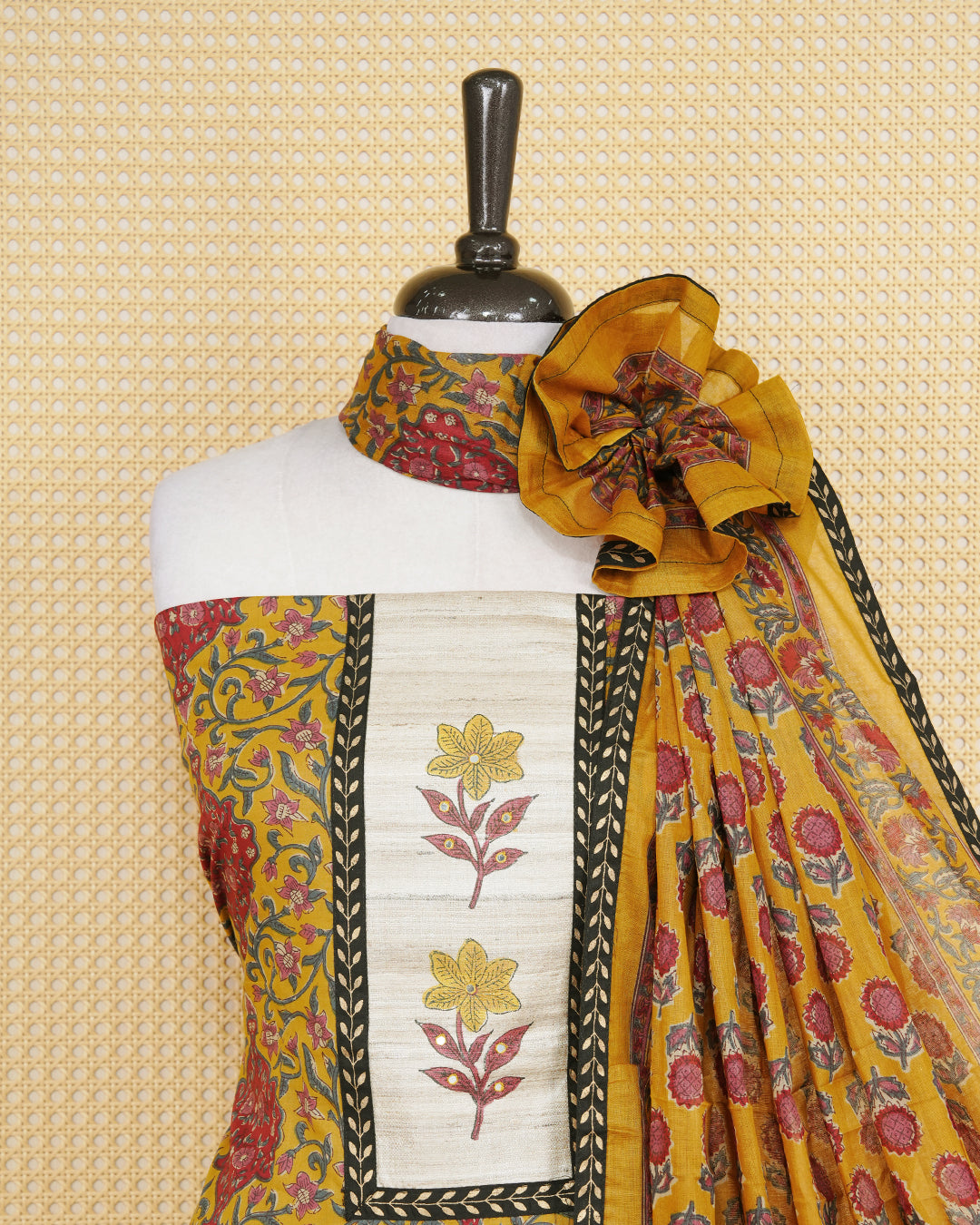 Dark yellow colour salwar material featuring Floral print and mirror work with elegant border, paired with matching bottom and an elegant dupatta.