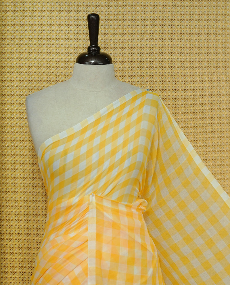 Yellow & white Mul cotton saree featuring Small Check pattern across body, complemented by Elegant Tassels.