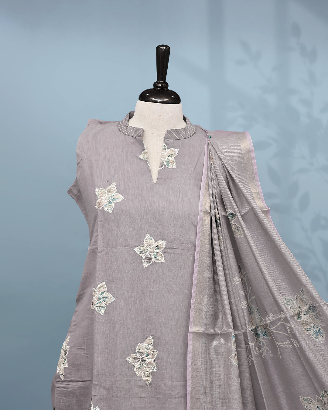 Lavender colour Salwar set comes top with floral pattern on body, paired with matching bottom and dupatta.