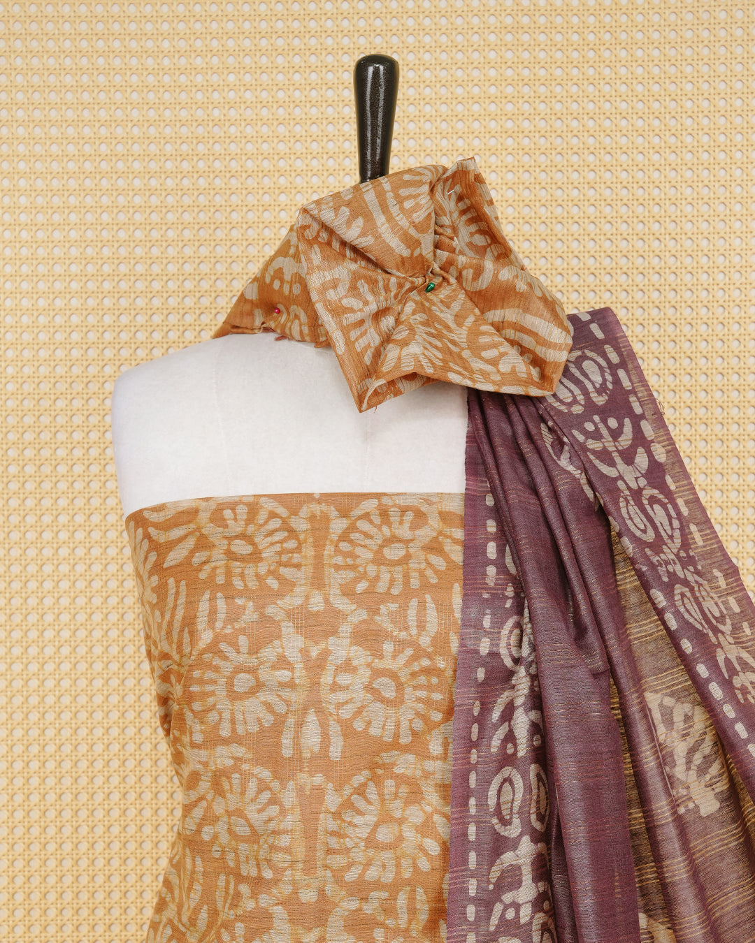 Brown Cotten Silk Salwar Mateirial Features an Elegant Floral Batik Print Pattern Aborned With Fine Weaved Zari highlights, Paired with matching bottom & elegant Dupatta