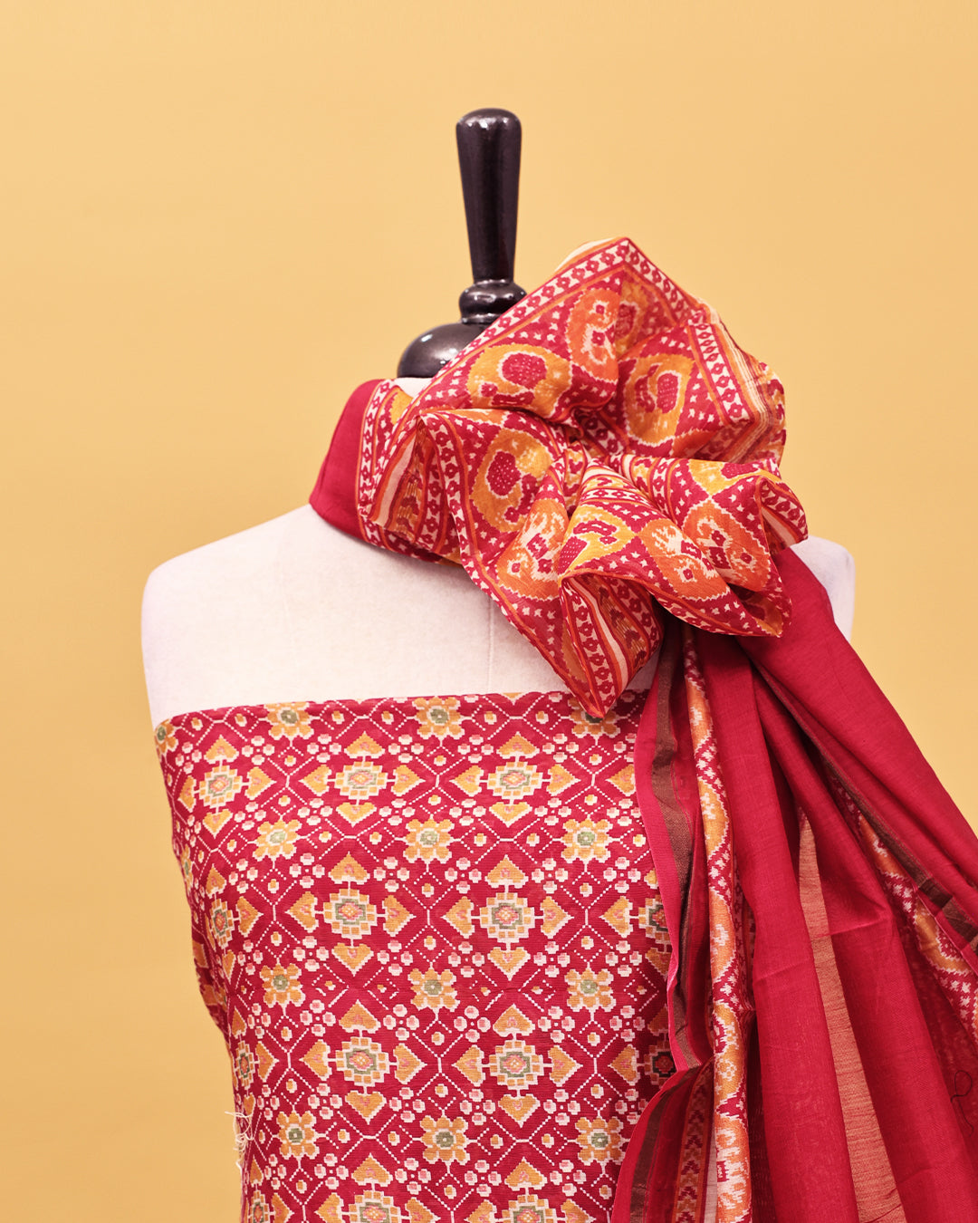 Red colour Salwar material with Geometric pattern print on body, matching bottom & Dupatta.