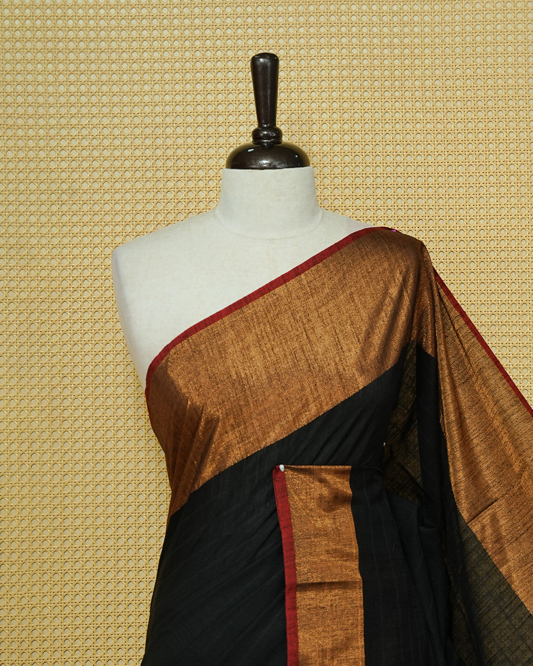 Black Colour Mul Cotton Saree featuring an elegant plain body, complemented by a rich copper zari border and a maroon contrast pallu with red and black tassels.
