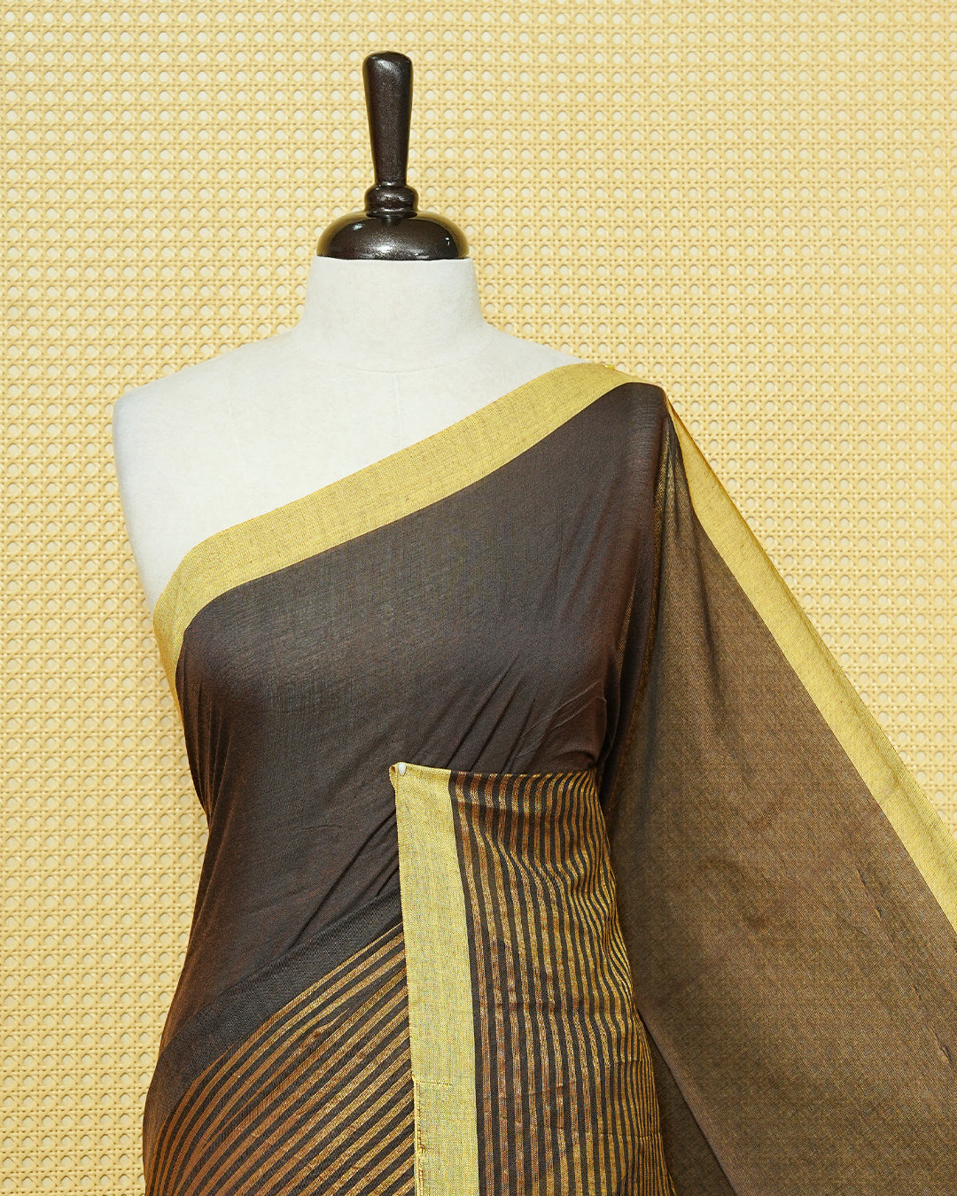Dark Brown Colour Mul Cotton Saree with a plain brown body, elegant Olive border, and striped pallu. Finished with a matching tassels