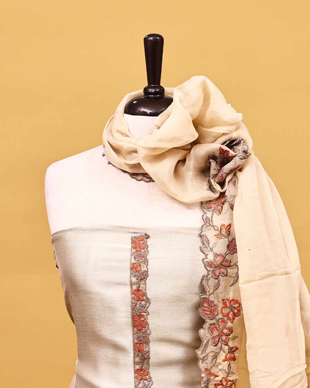 Beige colour Organza Salwar material with Thread work on body, matching bottom & Dupatta.