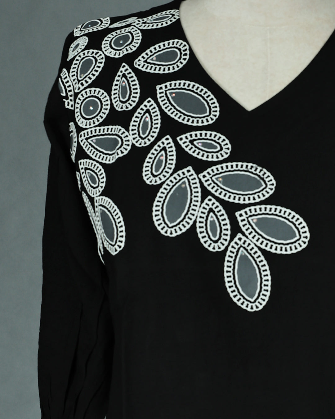 Black colour Top with Thread work on body, V Neck design, With sleeve.