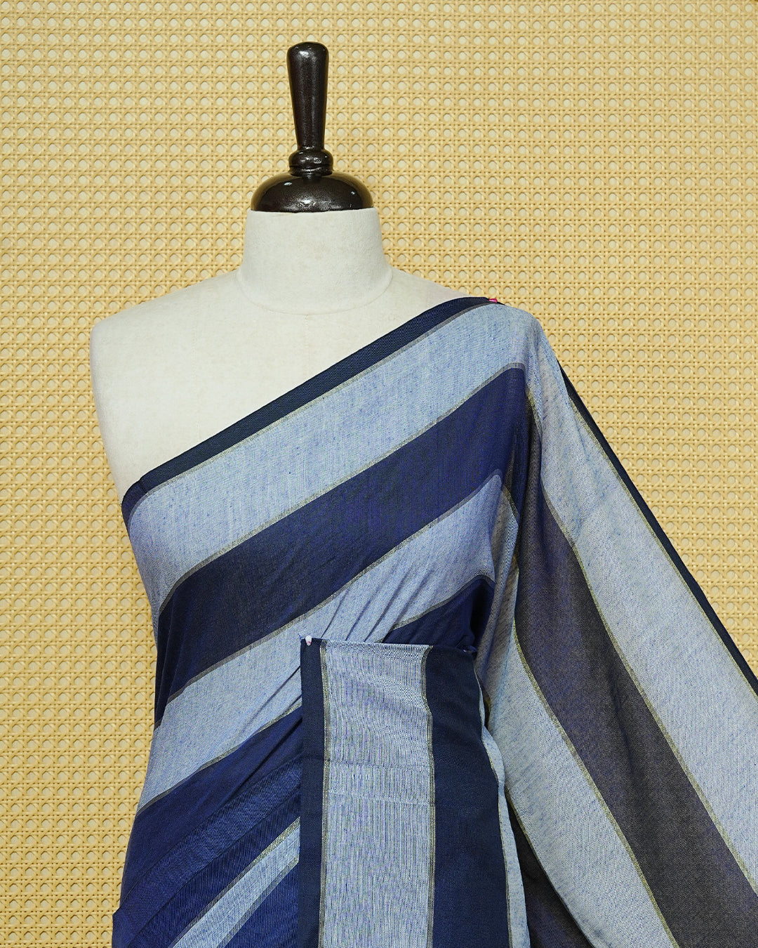 Navy Blue & Light Blue colour Mul cotton saree featuring Gold zari strips, complemented by self colour simple Border & tassels.