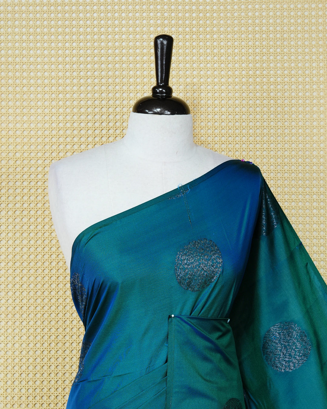 Peacock blue colour soft silk saree featuring antique zari motifs on body with contrast self colour pallu & paired with matching blouse piece.