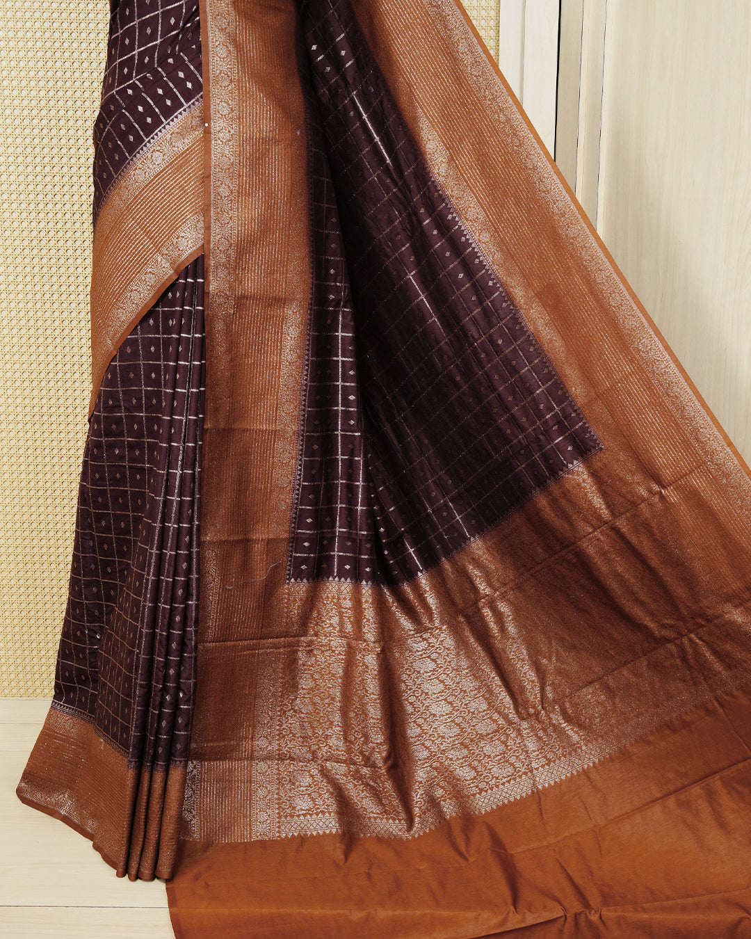 Dark brown Colour Semi georgette Saree having zari check with buttas pattern on body, contrast dark mustard colour floral designed border, Rich Pallu comes with Matching Blouse piece.