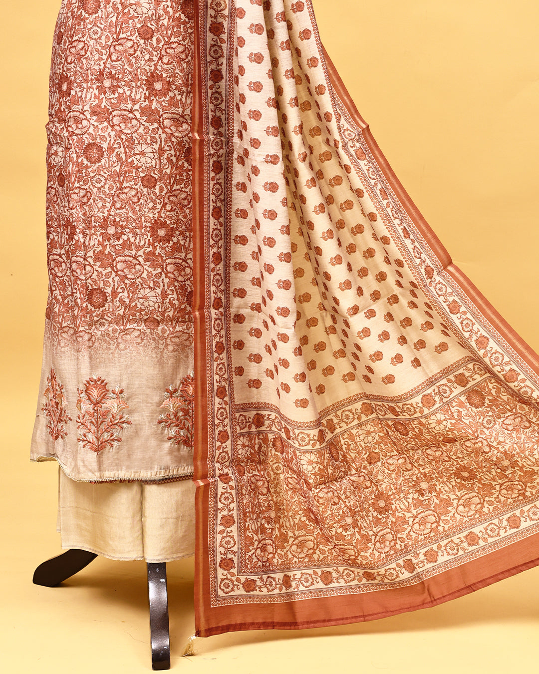 Brown colour Salwar material with Floral kodi pattern on body, matching bottom & Dupatta.