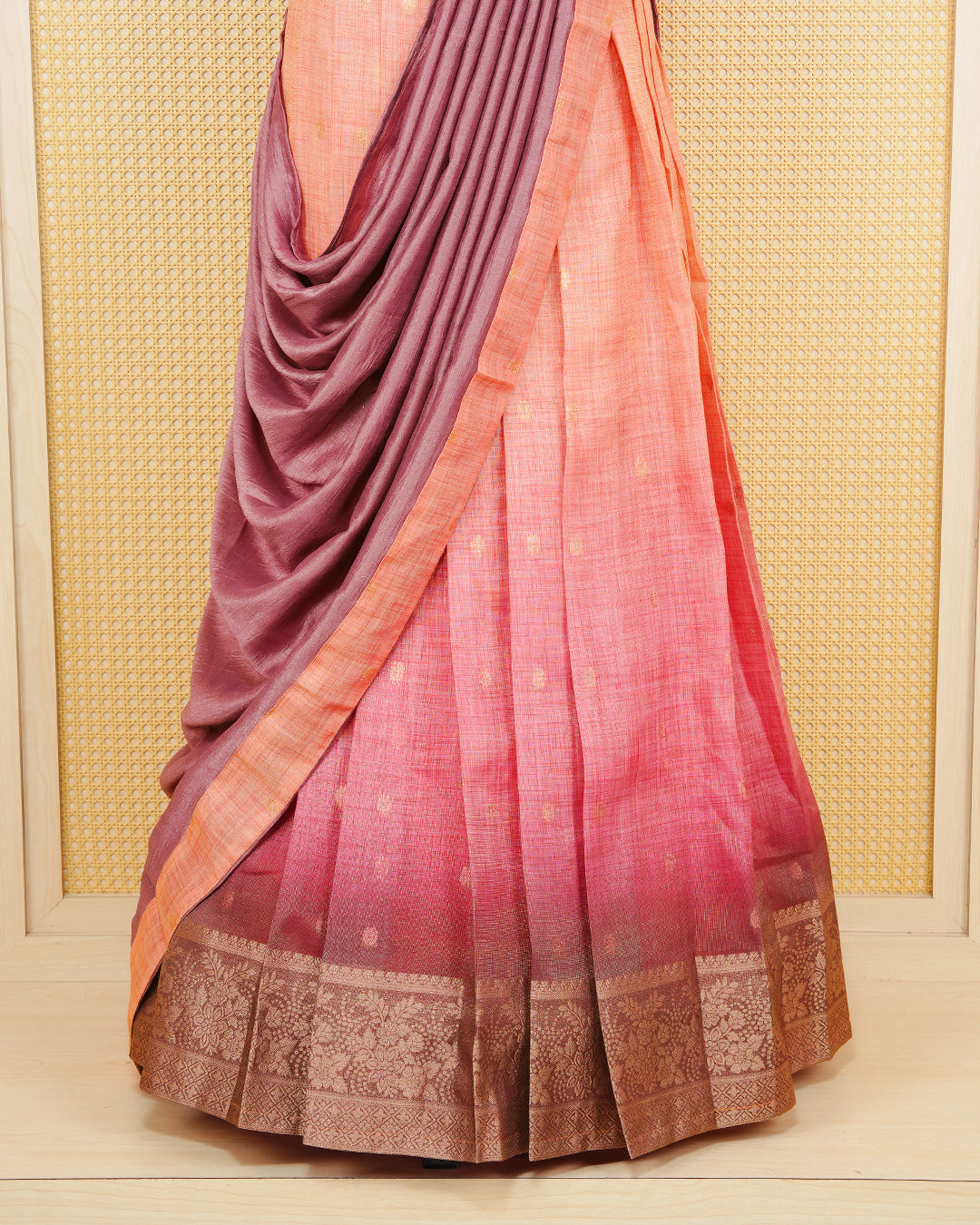 Peach & dusty maroon colour Linen Silk Semi stitched dhavani set featuring buttas, zari bordered skirt & blouse piece and dupatta.