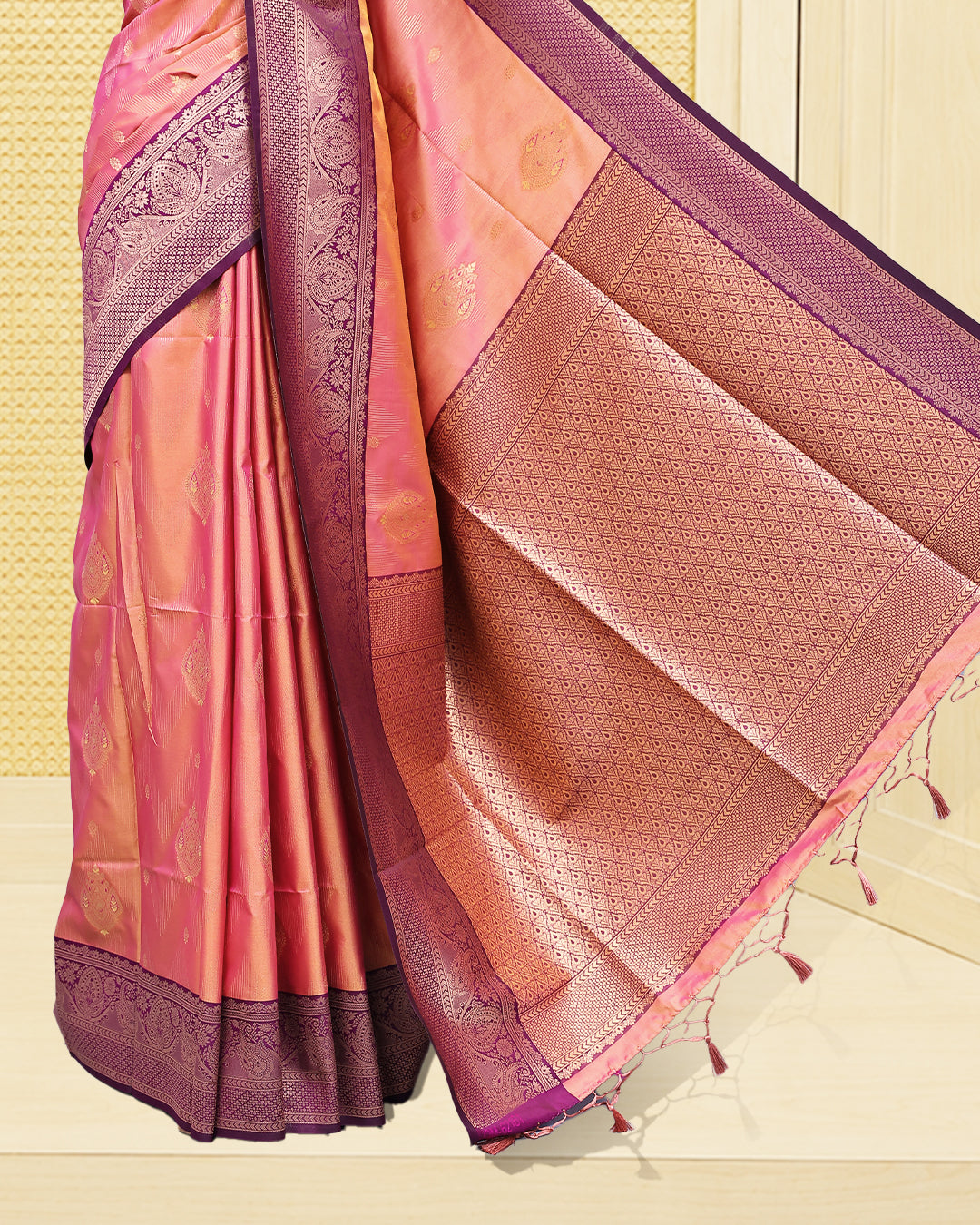 Peach & gold double shade Mulberry silk saree featuring floral gold zari patterns on body, paired with contrast purple colour with traditional border, comes with matching blouse piece.