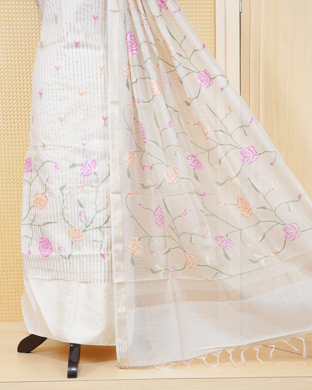 Cream colour tissue salwar material featuring beautiful floral embroidery design with elegant border, paired with matching bottom and beautiful dupatta.