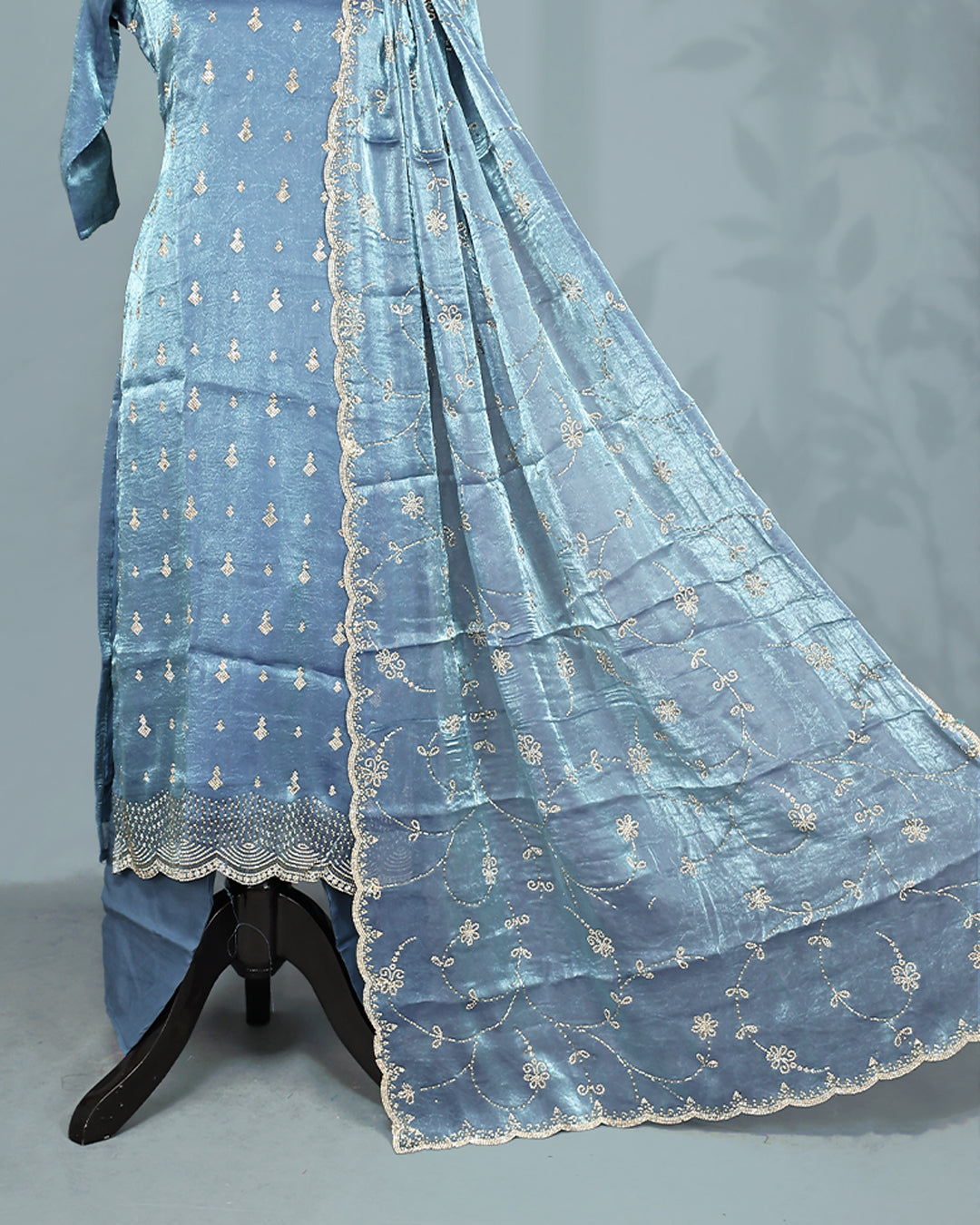 Steel colour Salwar set comes top with Stone work on body, paired with matching bottom and dupatta.