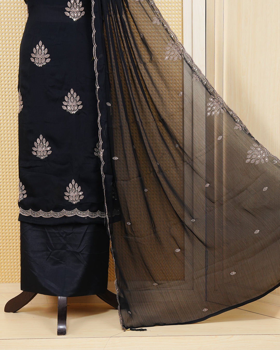 Black Georgette Salwar material Featuring Intericate Gold Emproidary Leaf Motifs and scalloped Border Work Highlighted With subtle sequin Accents, paired with a matching bottom & elegant Duptta