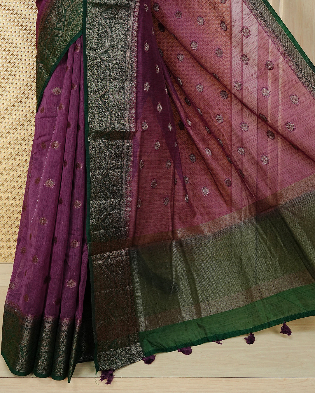 Onion pink colour semi linen saree thread motifs on body, contrast dark forest green colour gold zari border, rich pallu comes with matching blouse piece
