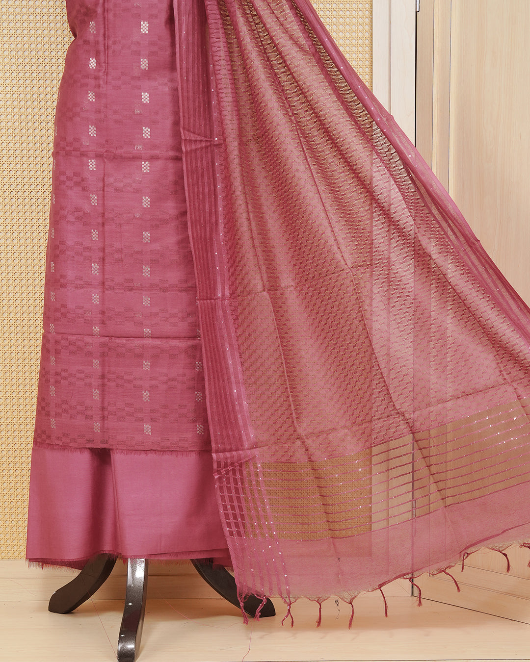 Maroon colour silk cotton salwar material featuring gold zari design without border, paired with matching bottom and beautiful dupatta.