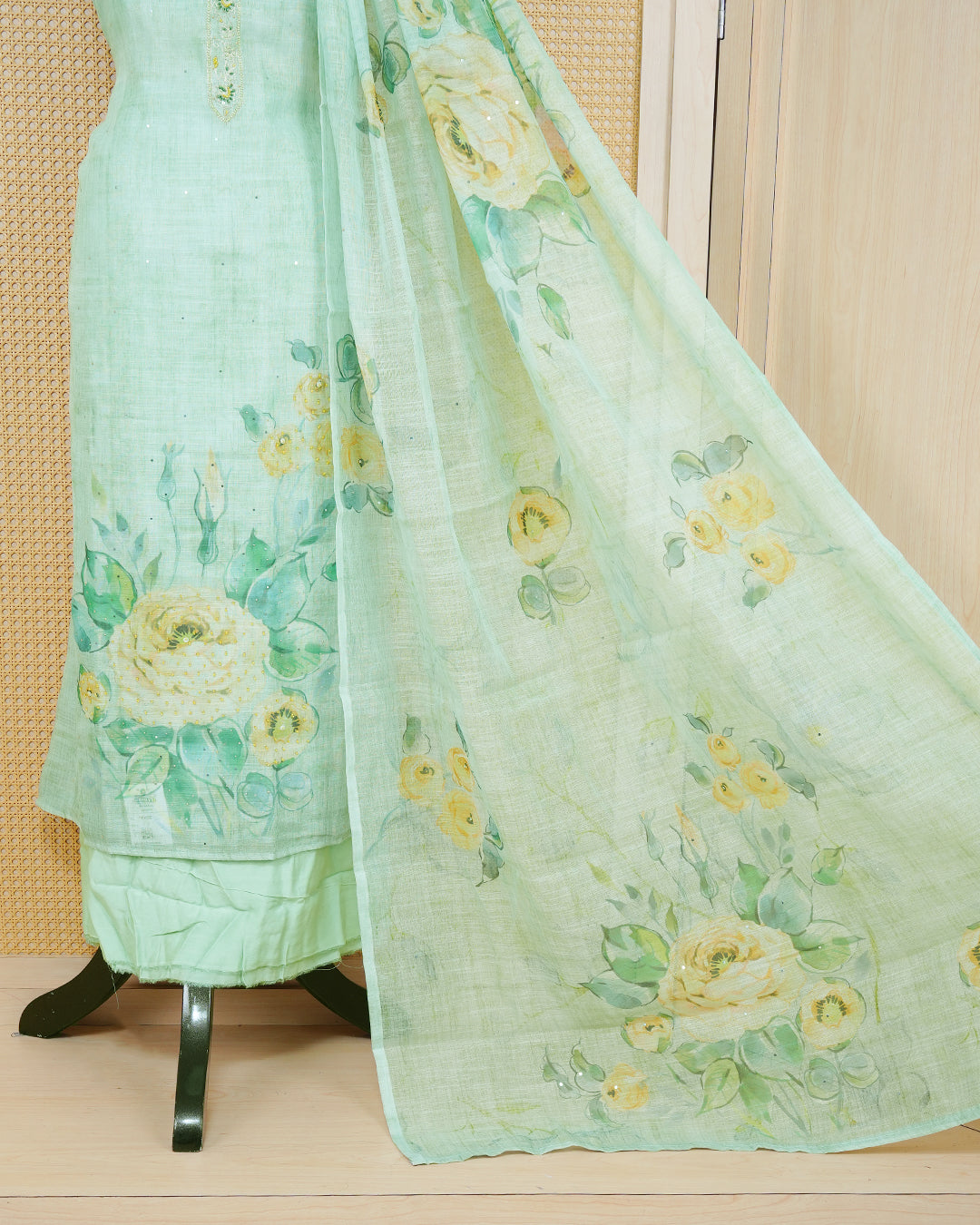 Pastel Green Linen Salwar Material featuring beadwork on the neck yoke, mirror work, and floral prints, paired with a matching bottom and dupatta.