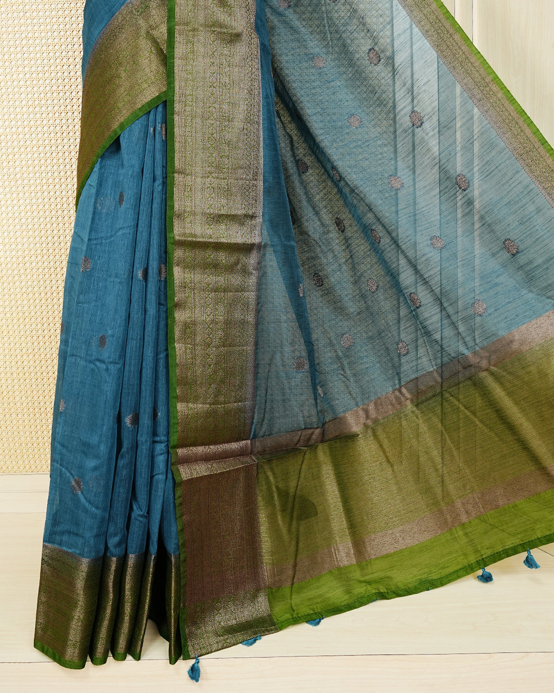 Peacock blue colour semi linen saree thread motifs on body, contrast maroon colour gold zari border, rich pallu comes with matching blouse piece
