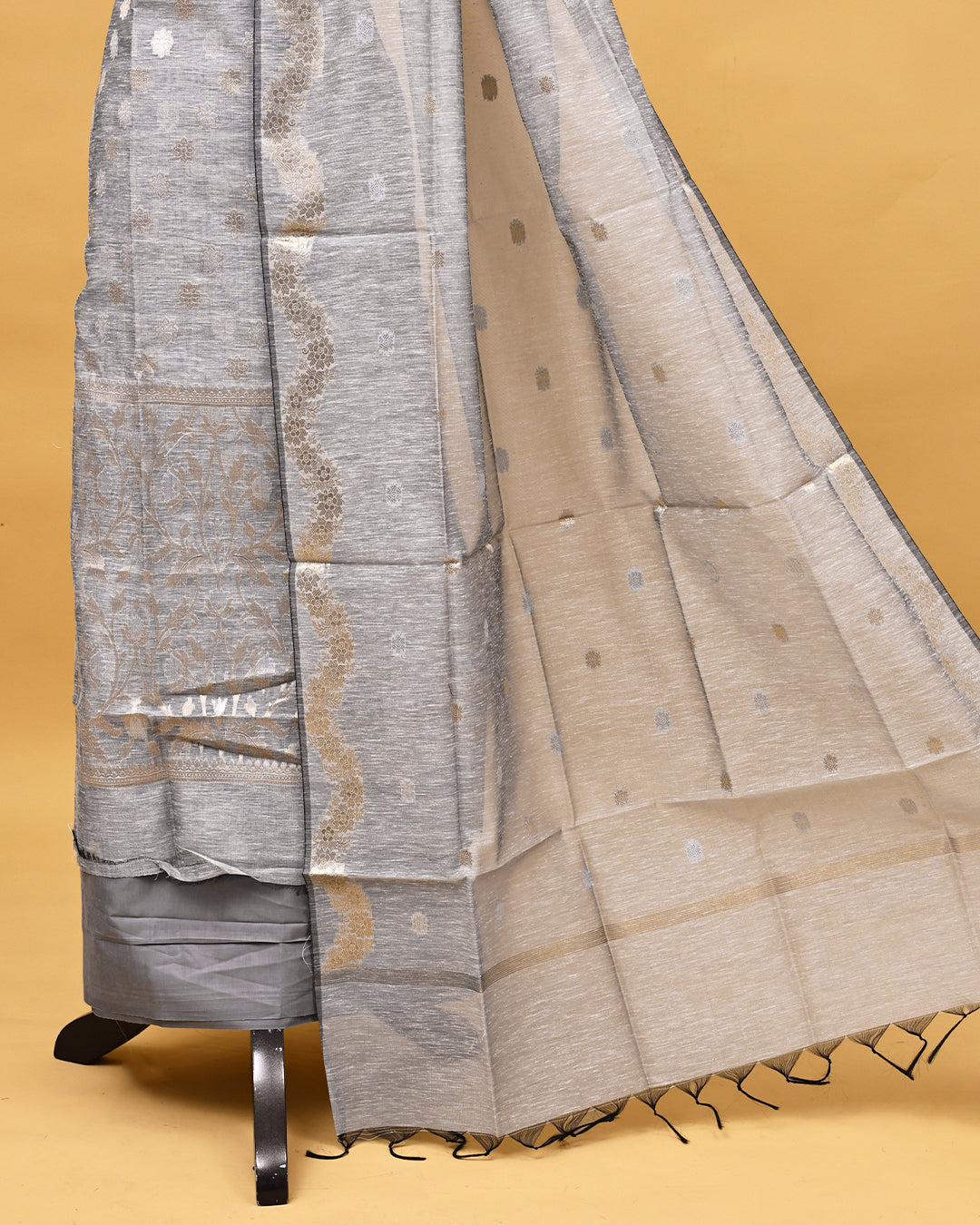 Grey colour linen Salwar material with Gold zari kodi pattern on body, matching bottom & Dupatta.