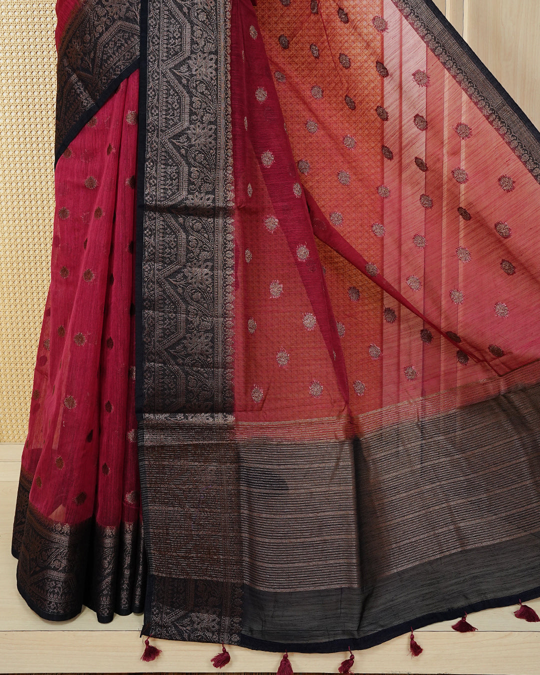 Dark magenta colour semi linen saree thread motifs on body, contrast dark colour gold zari border, rich pallu comes with matching blouse piece