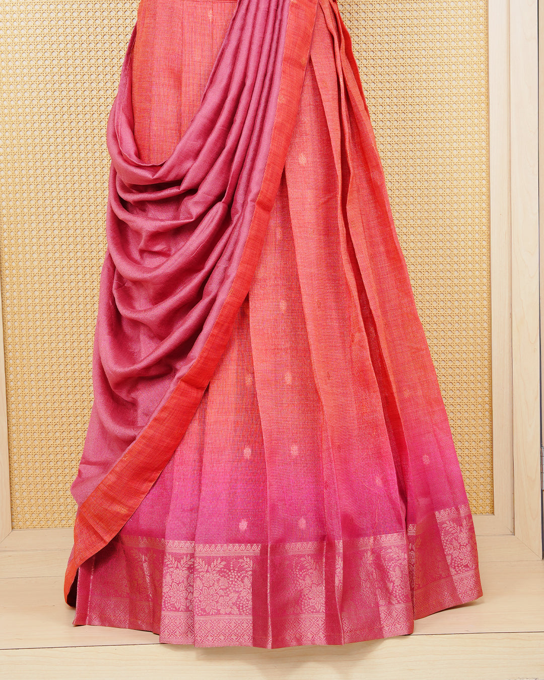 Burnt orange & magenta pink colour Linen Silk Semi stitched dhavani set featuring buttas, zari bordered skirt & blouse piece and dupatta.