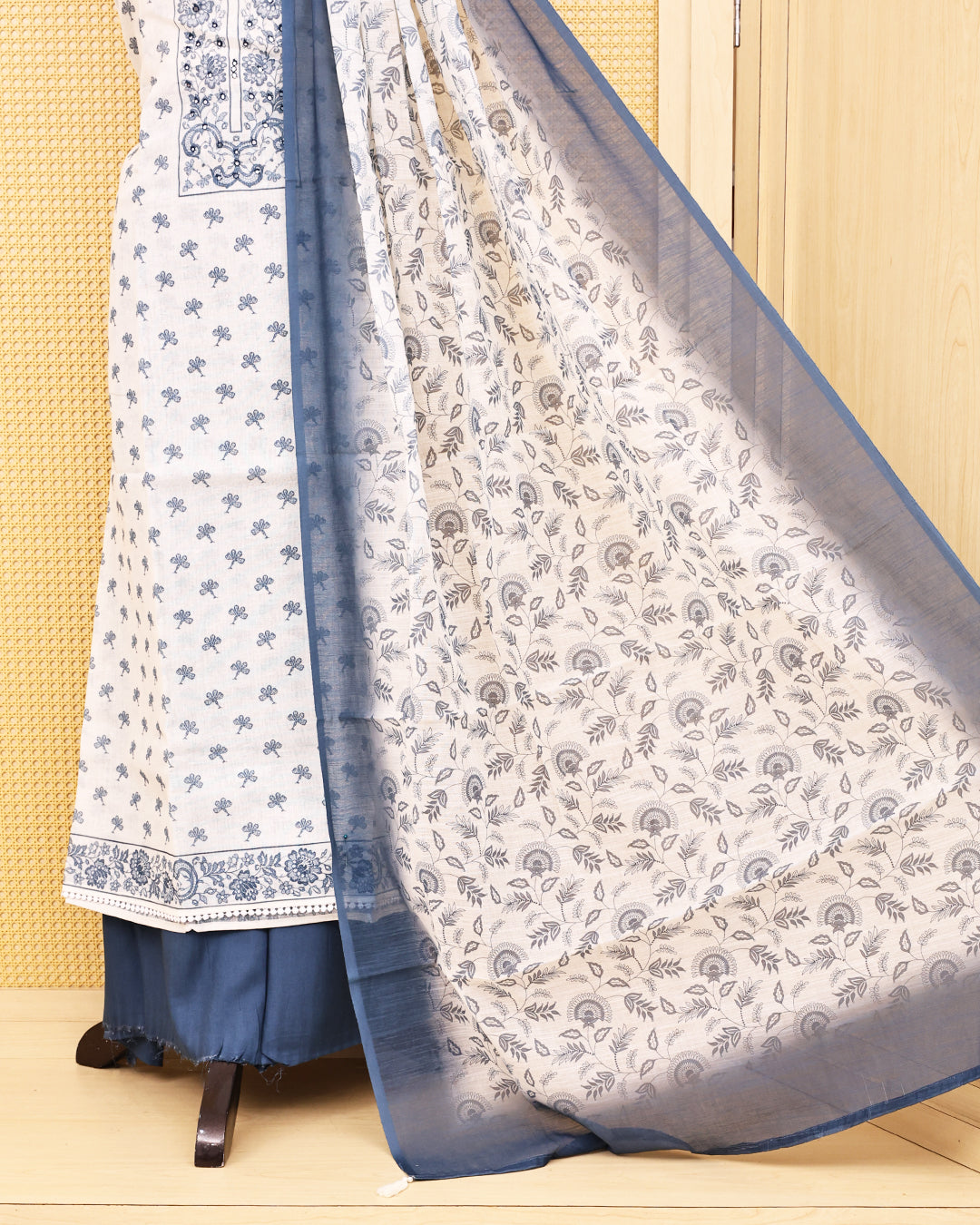 Off White colour Linen salwar material featuring Print & mirror work on body, paired with Contrast Greyish Blue colour bottom & dupatta.