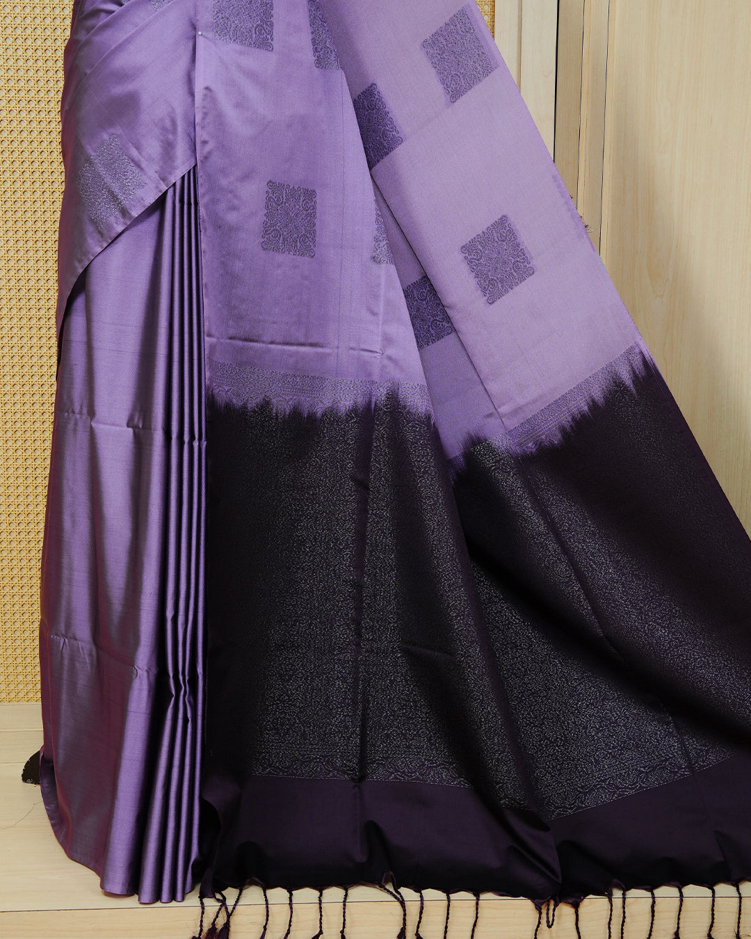 Lavender colour soft silk saree featuring antique zari motifs on body with contrast deep purple colour pallu & paired with matching blouse piece.