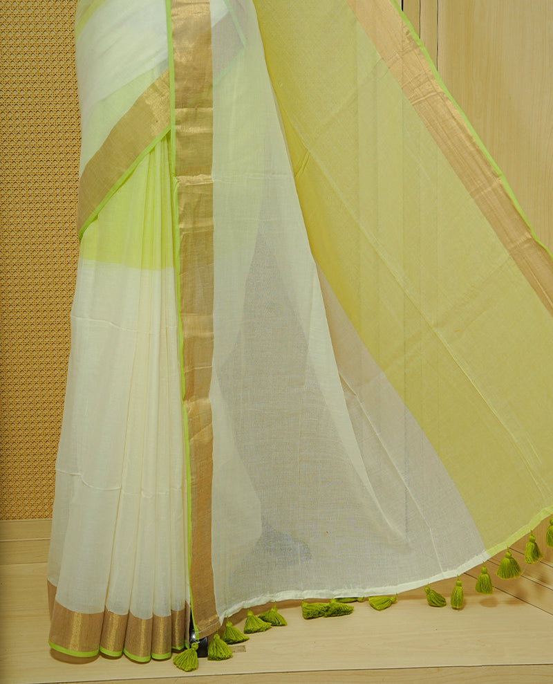 Light green & White Colour Half & Half Mul cotton saree Complemented by contrast Green colour Border & tassels.