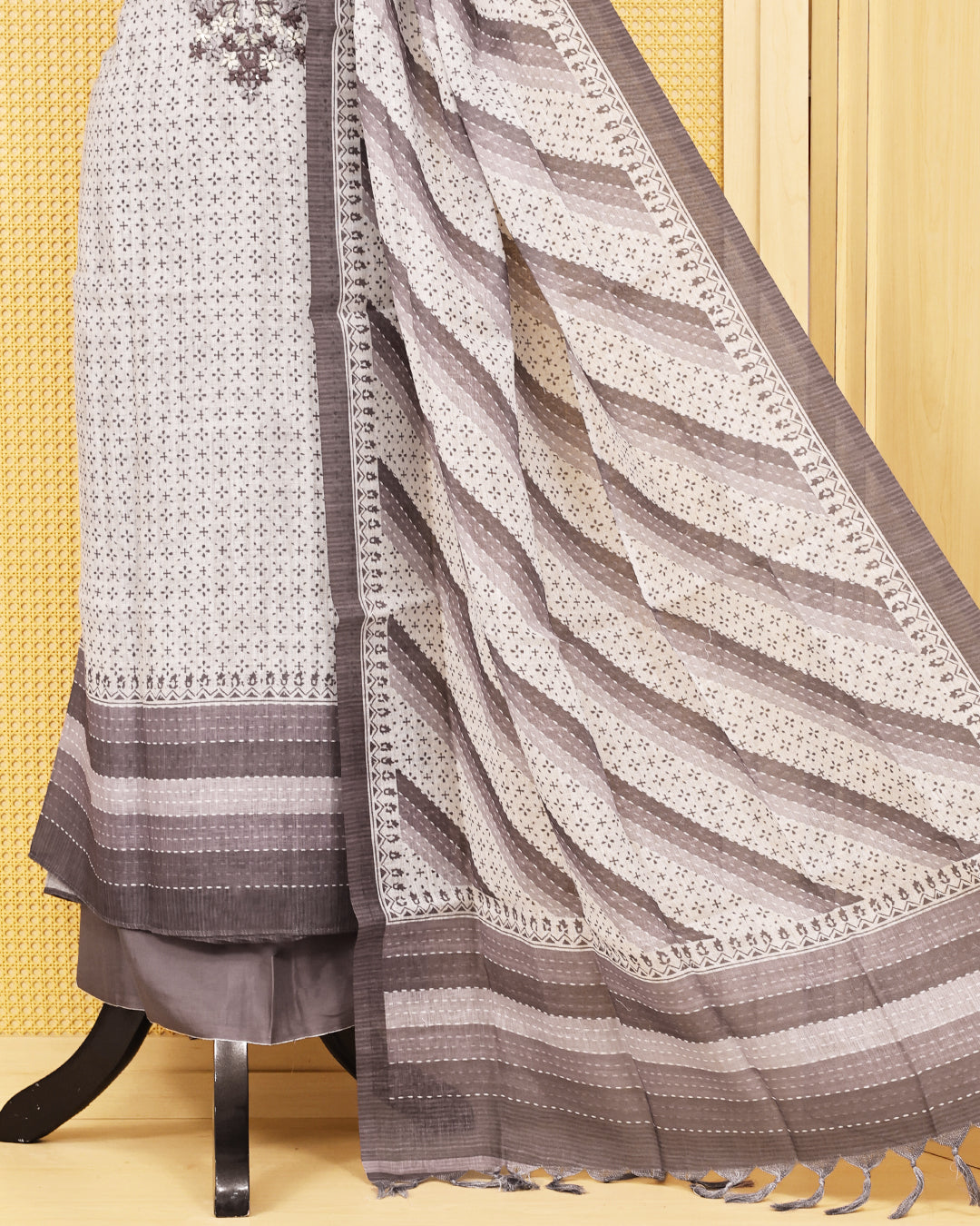 Off White colour Linen salwar material featuring Thread work with print on body, paired with Contrast Greyish beige colour bottom & dupatta.