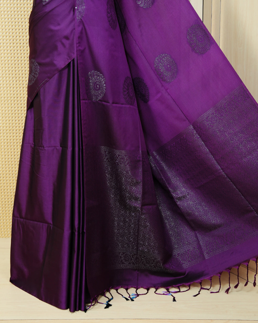 Deep purple colour soft silk saree featuring antique zari motifs on body with contrast self colour pallu & paired with matching blouse piece.