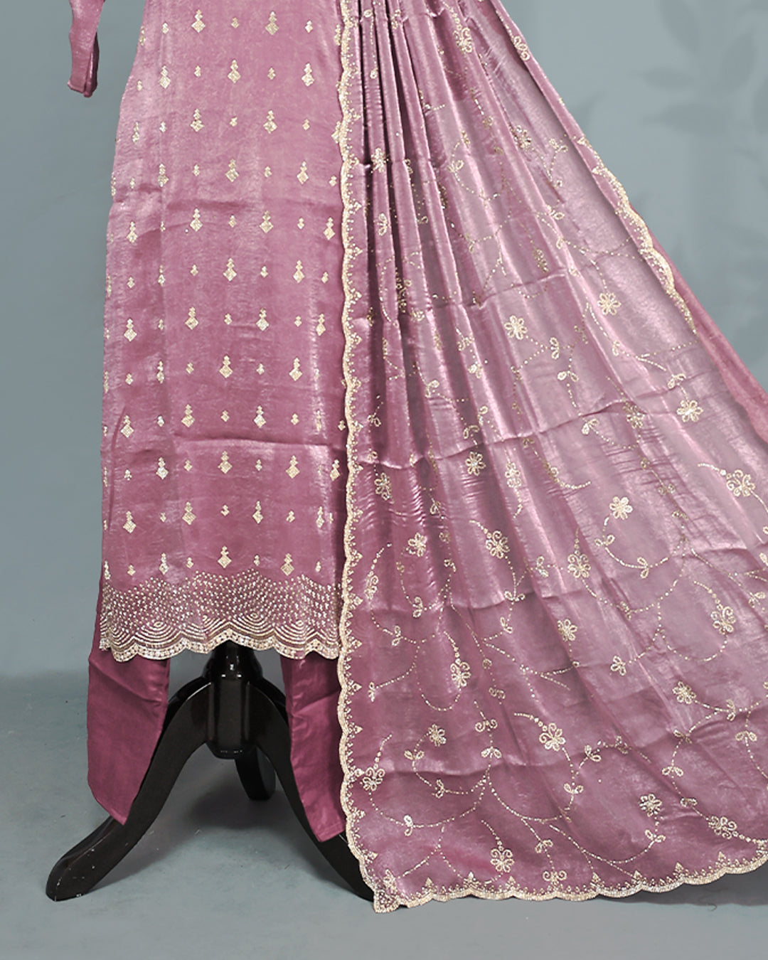 Mauve colour salwar set with Stone work on top, paired with matching bottom & Dupatta.