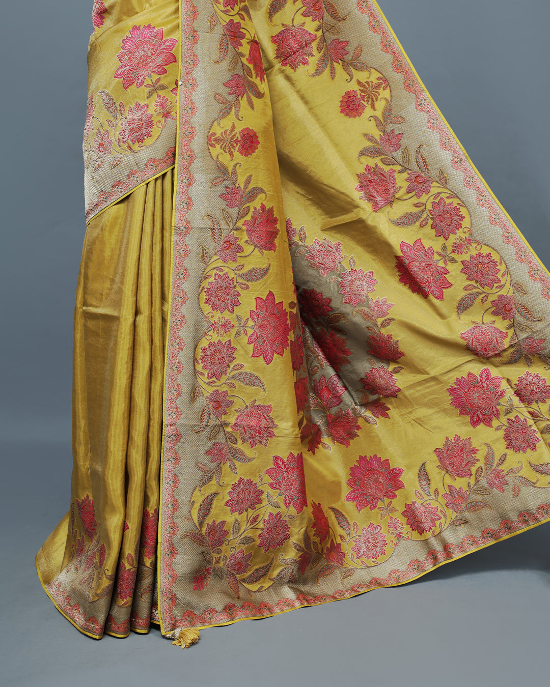Olive yellow Colour Pashmina Saree featuring Plain body, complemented by Contrast colour with Floral pattern & gold zari on border and Pallu, comes with matching blouse piece.