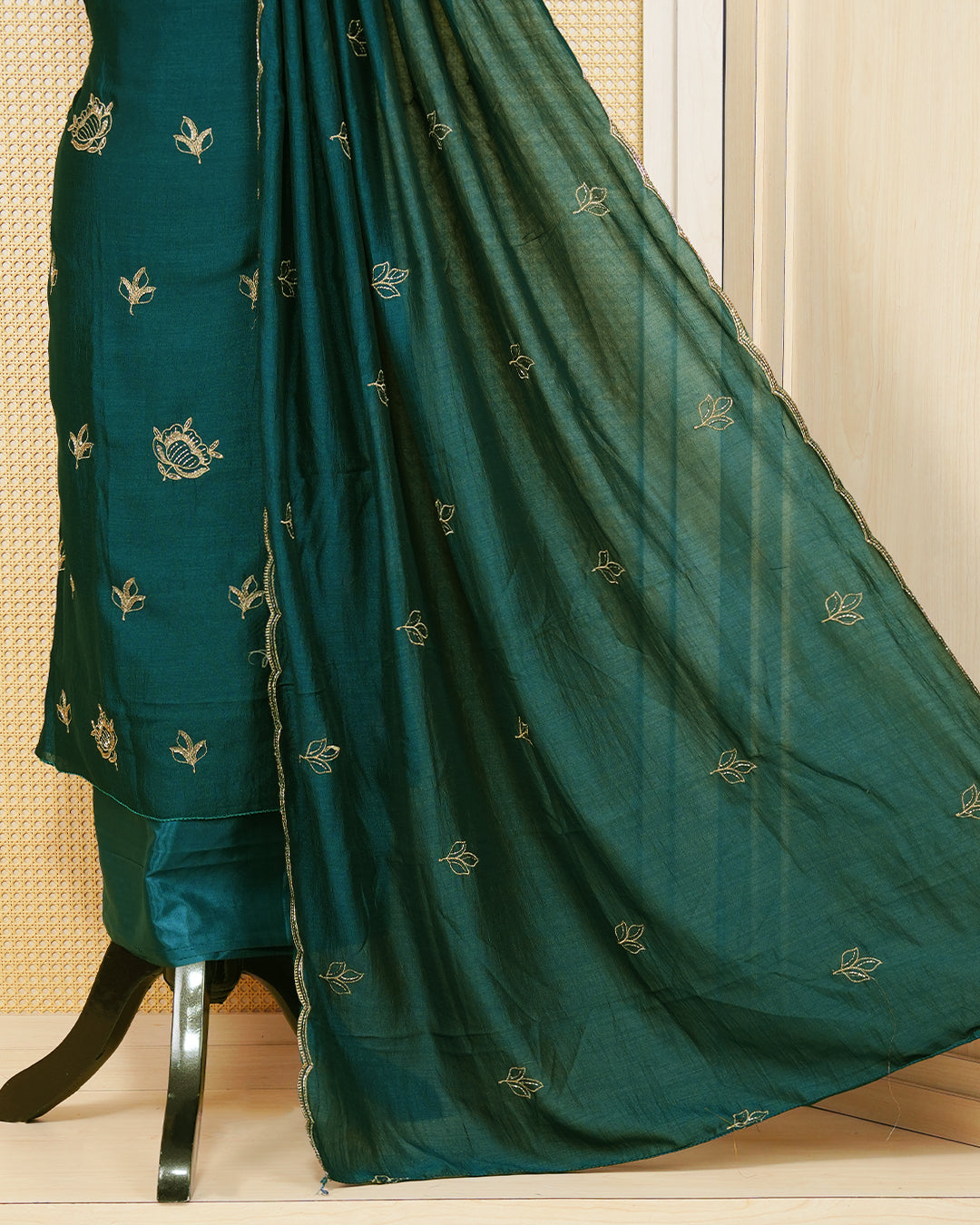 Dark Green Georgette Salwar Matirial Features an Elegant Floral Embroidary Pattern Adorned With Shimmering Metalic Gold Thread and Bead Work, paired with matching bottom & elegant Duptta