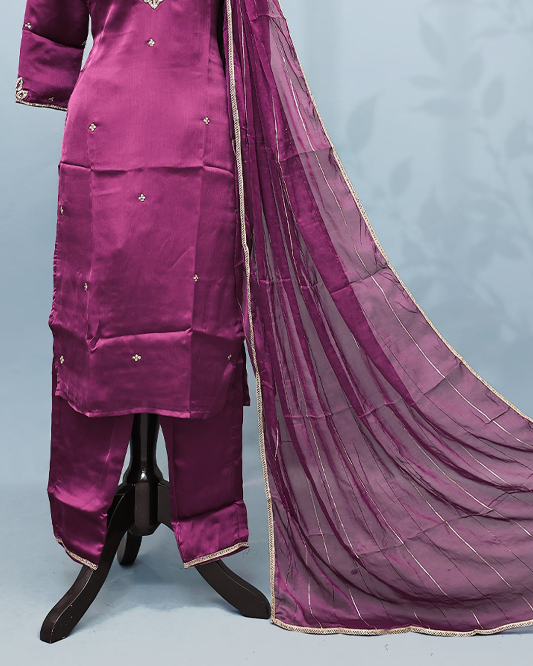 Purple colour Salwar set comes top with Stone work on body, paired with matching bottom and dupatta.