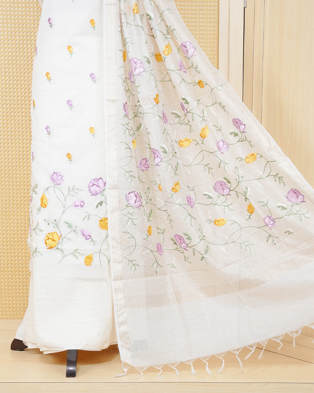 Cream colour tissue salwar material featuring beautiful floral embroidery design with elegant border, paired with matching bottom and beautiful dupatta.