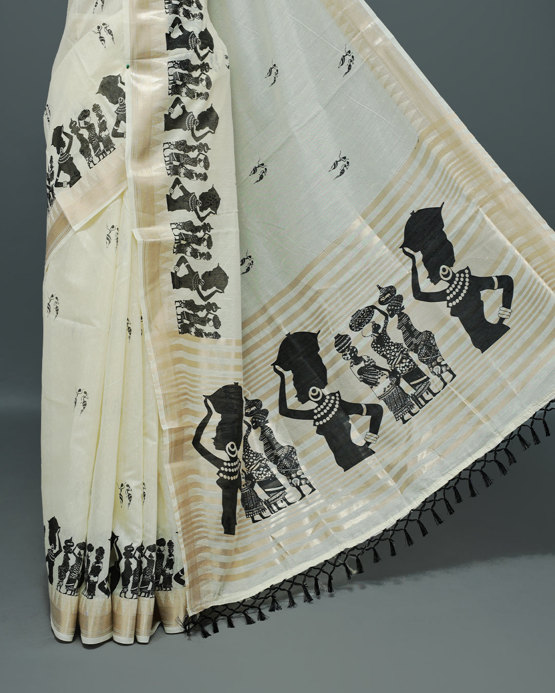 Cream colour Semi chanderi kerala saree featuring Black colour Print on body, complemented by Light Gold zari Border, paired with matching blouse piece.