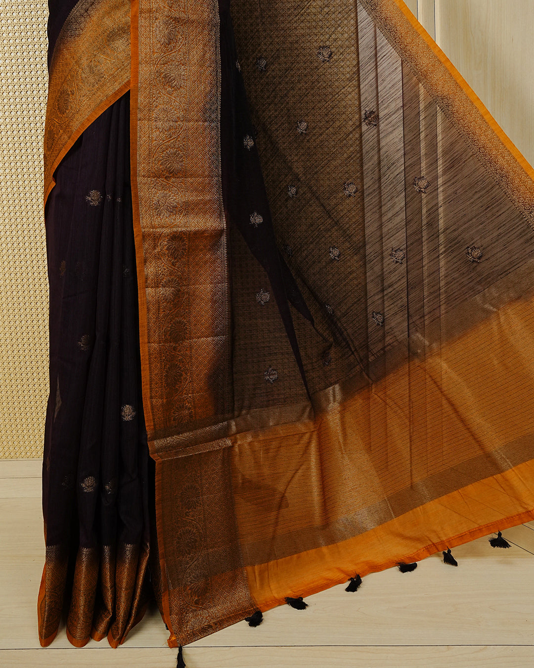 Dark brown colour semi linen saree thread motifs on body, contrast mustard orange colour gold zari border, rich pallu comes with matching blouse piece