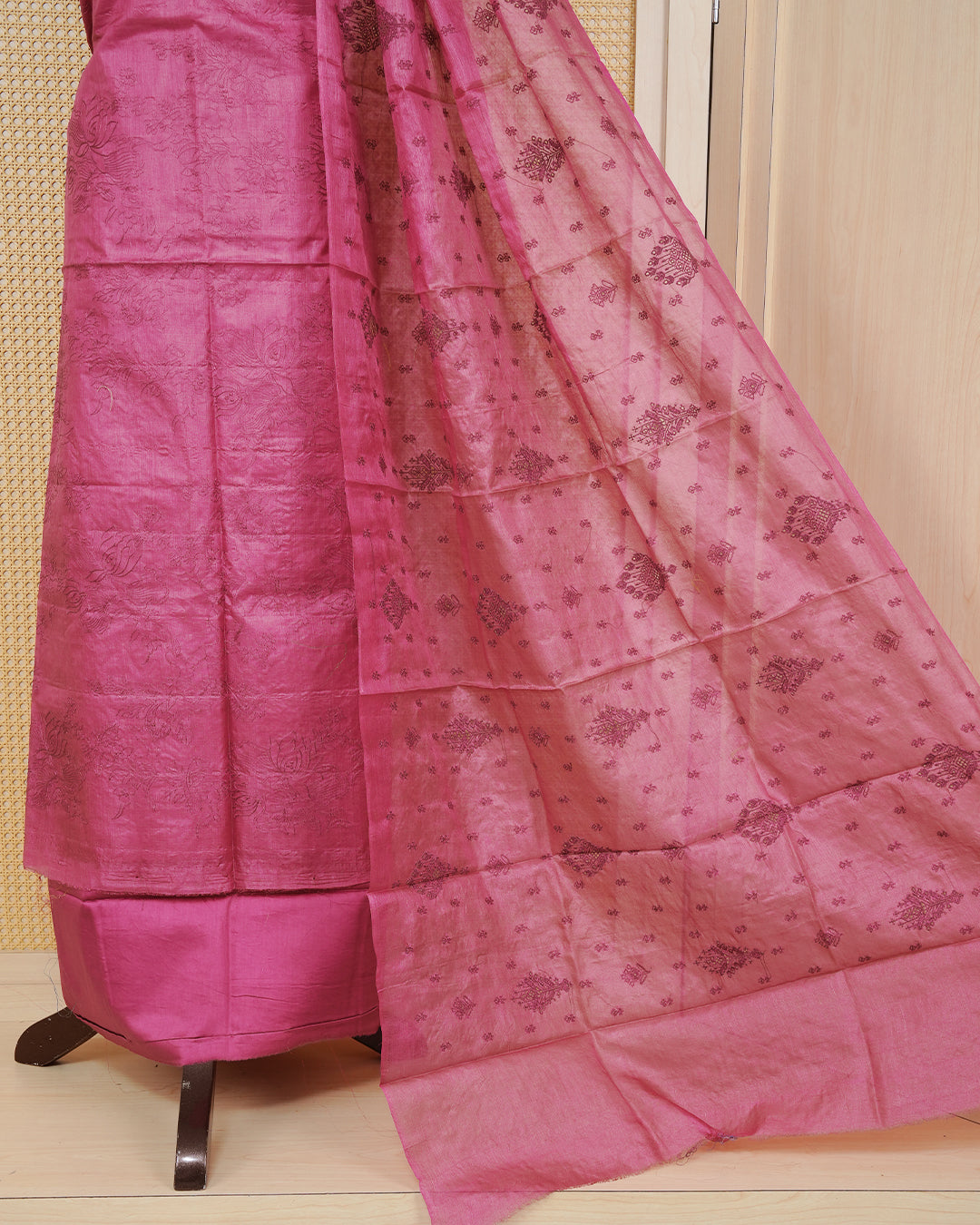 Dusty pink colour Tussar Salwar material featuring Threadwork on the body, paired with a matching bottom and an elegant dupatta.