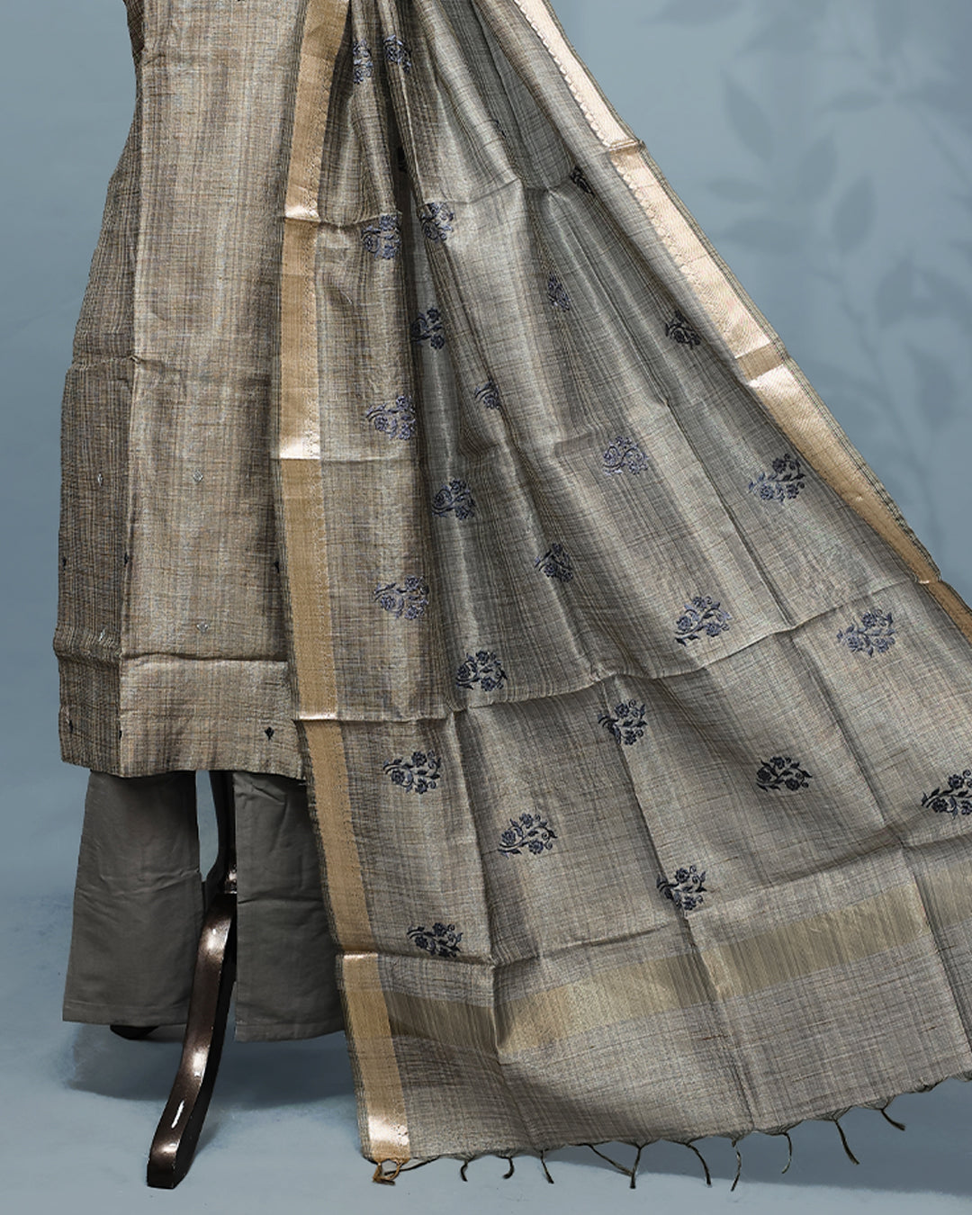 Golden grey colour Salwar set comes top with thread work on body, paired with matching bottom and dupatta.