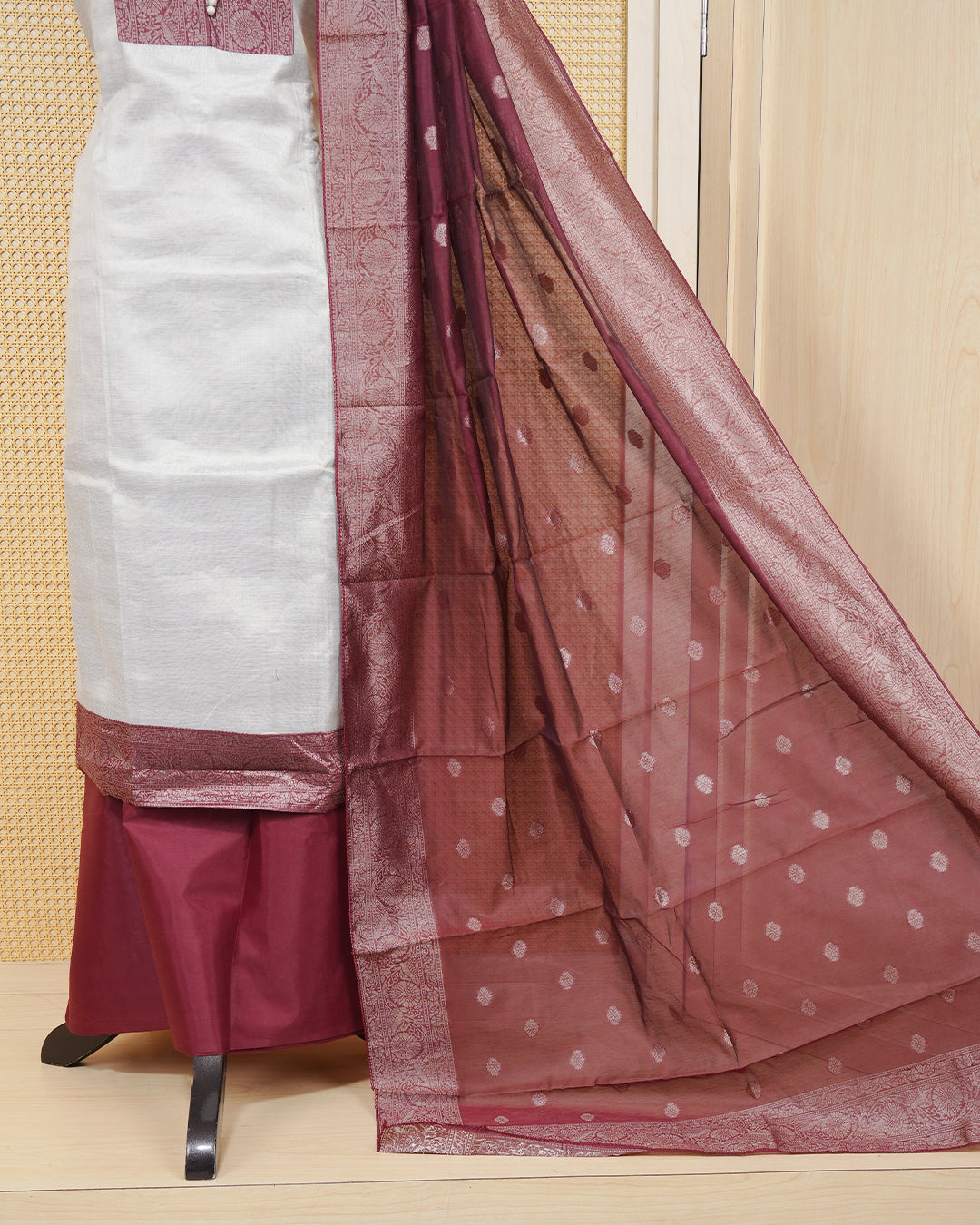 Cream colour tissue salwar material featuring plain body ,maroon colour with floral work on chest portion, Paired With a Matching Bottom and an Elegant Dupatta.