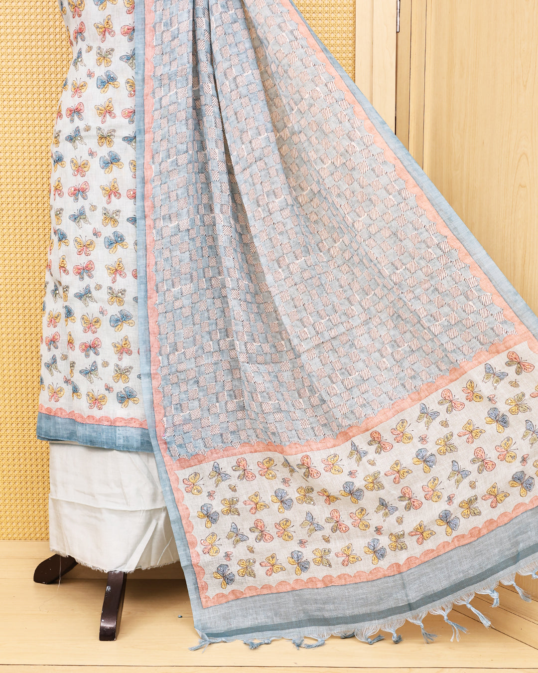 Pastel blue colour linen Salwar Material featuring delightful multicolor butterfly motifs, paired with a classic white bottom and a beautifull dupatta