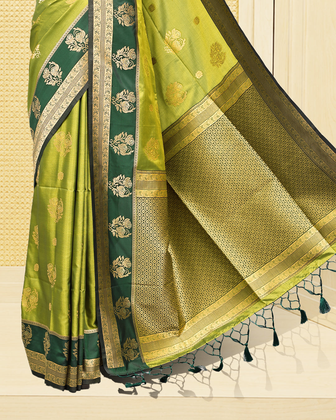 Olive green & gold double shade Mulberry silk saree featuring floral gold zari patterns on body, paired with contrast forest green colour with traditional border, comes with matching blouse piece.